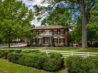 Brick Farmhouse and Front Yard