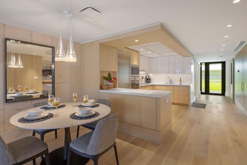 Light Wood Kitchen and Dining Area With Midcentury Modern Furniture