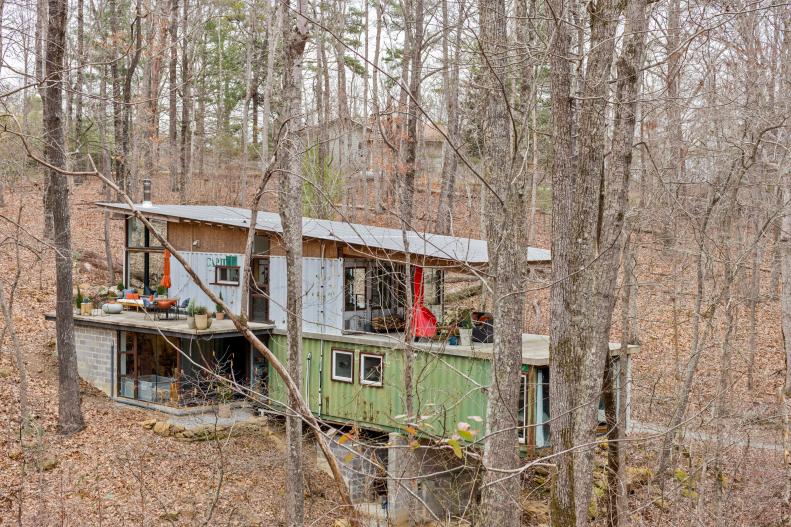 A shipping container home in the woods