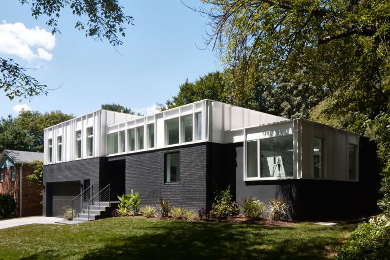 This black and white brick home has a Clerestory roof.