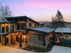 Modern Rustic Exterior on Mountain Mansion, Circle Drive, Warm Lights