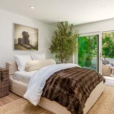Earthy, Coastal Bedroom With a Deck