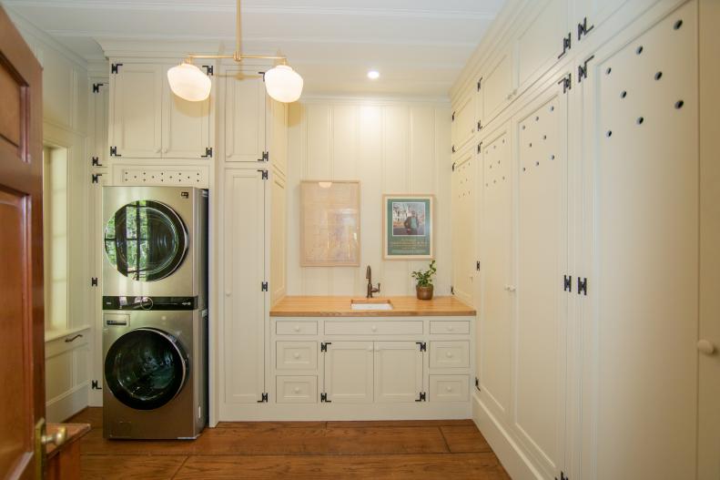 As seen on HGTV’s Hometown, Ben and Erin Napier have fully renovated their country home in Laurel, MS. The once small bedroom off the back door has been transformed into a spacious laundry room with custom cabinetry and butcher block countertops.