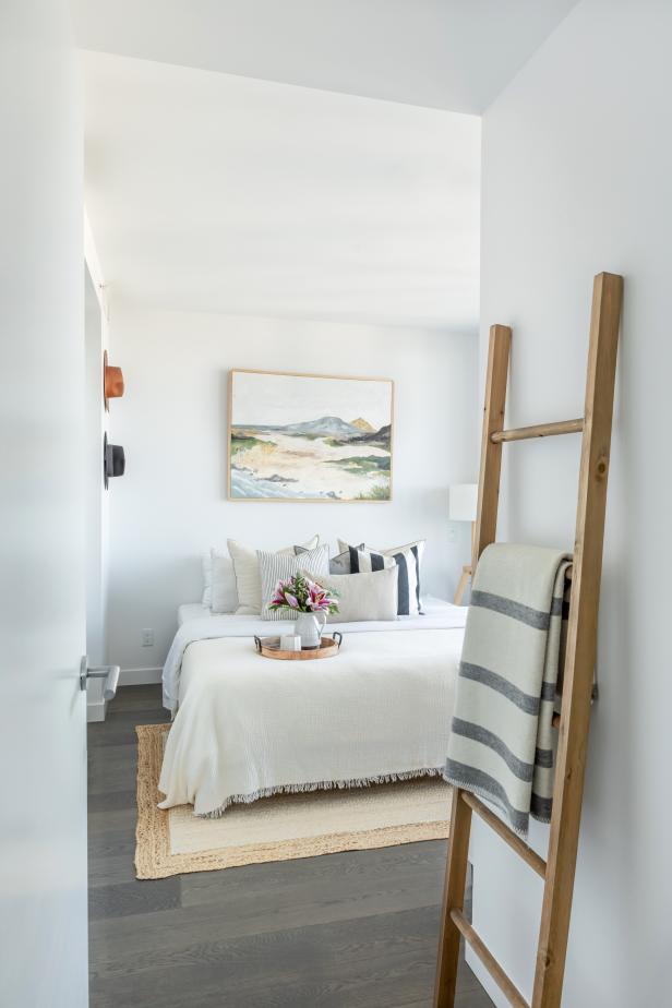 Doorway With Throw Blanket on Ladder and Bed in the Background 