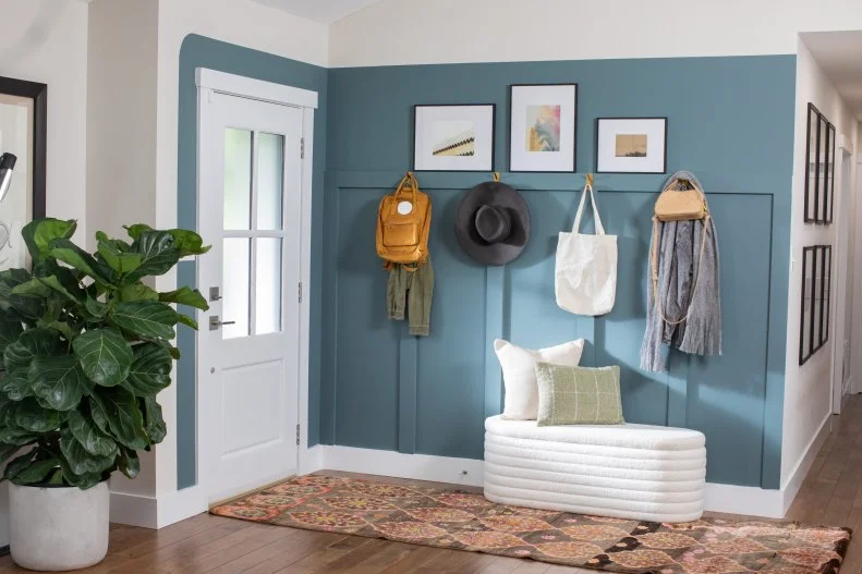 White Entryway With a Blue Paneled Accent Wall