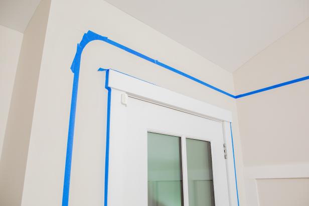 The next step in this DIY accent wall project is to apply painter's tape along the pencil lines to establish the paint border.