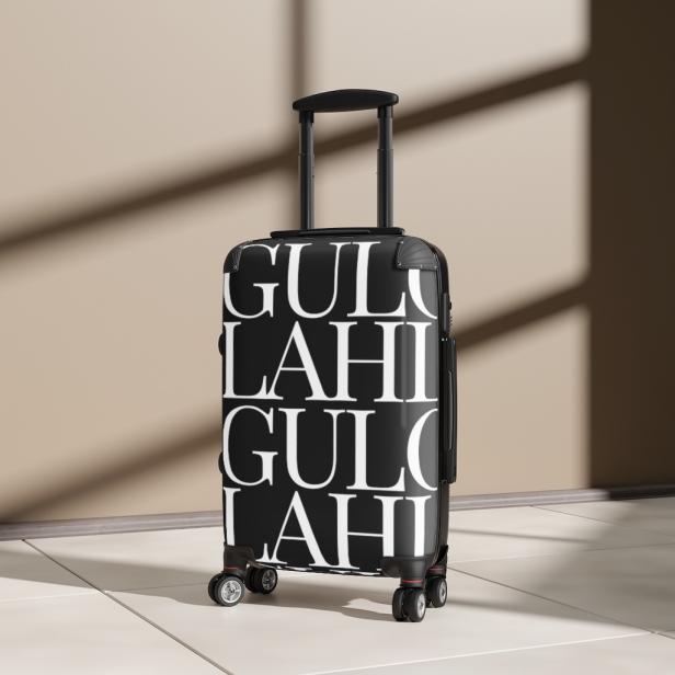A black carryon-size suitcase with white "Gullah" writing 
