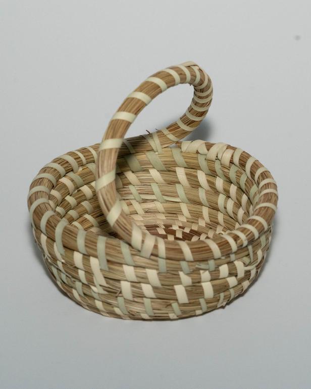 Sweetgrass Baskets are an African art form practiced by the Gullah Geechee people living in the Lowcountry area of South Carolina and Georgia. This basket is the creation of Mazie Brown, a sweetgrass basket-maker in Mt. Pleasant, South Carolina.