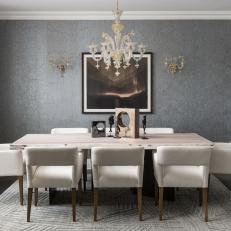 Transitional Dining Room With Glass Chandelier and Sconces 