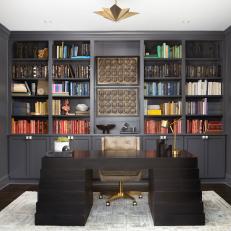 Dramatic Home Office With Floor-to-Ceiling Built-in Shelves 