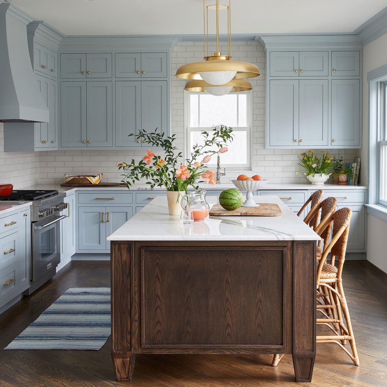 Transitional White Kitchen With Light Blue Cabinets and Brass Accents, 2023