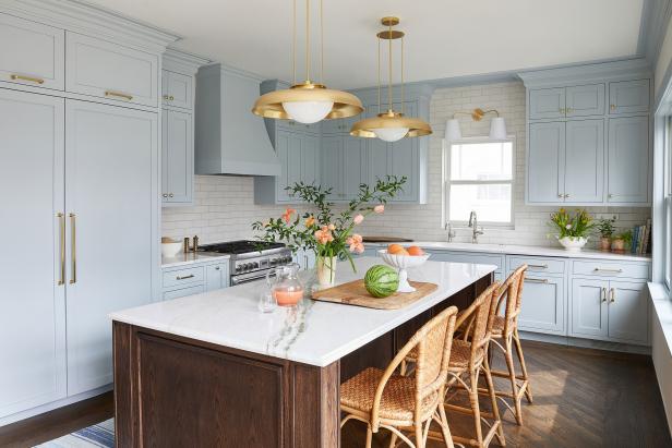 Transitional White Kitchen With Light Blue Cabinets and Brass Accents, 2023