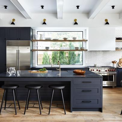 Black and White Open Plan Kitchen With Exposed Beam Ceiling