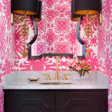Pink Tropical Powder Room With Black Sconces