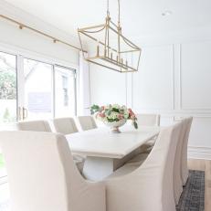 White Transitional Dining Room With Pink Roses