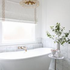 White Spa Bathroom With Brass Faucet