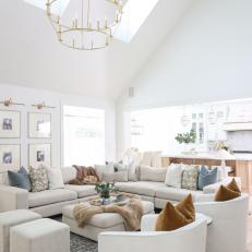 Neutral Transitional Living Room With Skylights