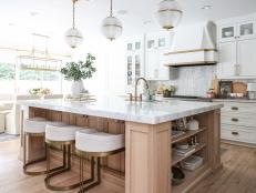 White Kitchen With Brass Stools