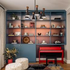 Living Room With Blue Built-In Shelving
