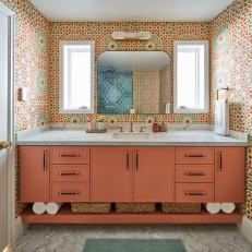 Bathroom With Coral Vanity and Geometric Tile