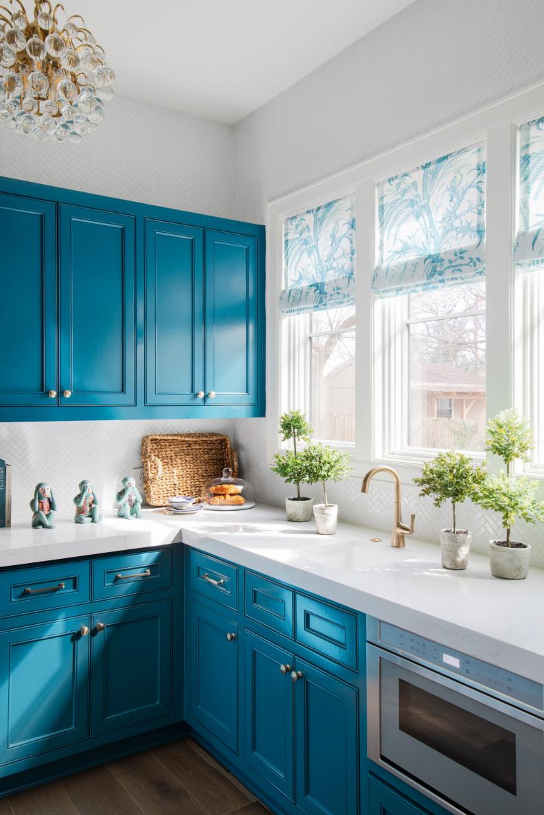 Corner of Kitchen With Built-in Appliance and Small Pot Filler Sink