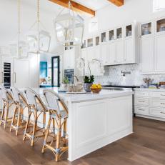 White Kitchen With Exposed Wood Beams