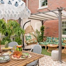 Eclectic Patio With Fringed Umbrella