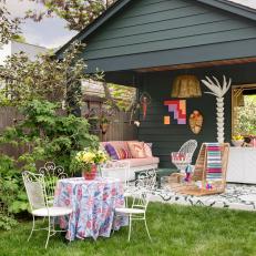 Multicolored Eclectic Covered Patio With Pink Sofa