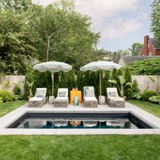 Small Backyard Pool With Green Umbrellas