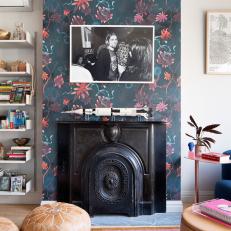 Eclectic Living Room With Black Fireplace and Floral Accent Wall 