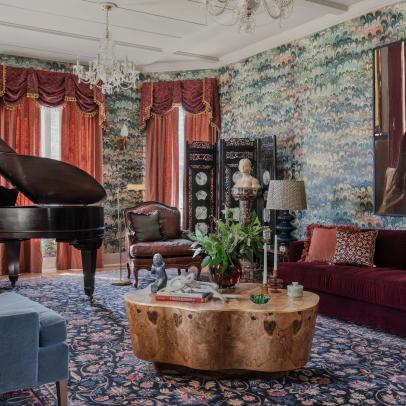 Maximalist Victorian Living Room With Floral Rug and Oversized Art
