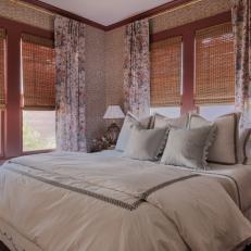 Rose-Colored Bedroom With Wood Blinds and Floral Curtains 