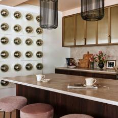 Eclectic Kitchen With Mismatched Pink Barstools