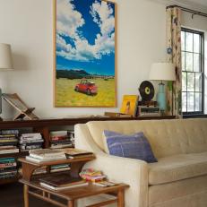 Transitional Living Room With Whimsical Art