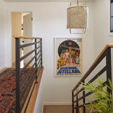 White Stairwell With Movie Poster and Jute Pendant Light