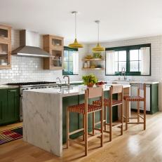 Kitchen With White Tile Walls and Green Cabinets