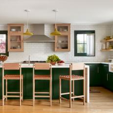 Open Kitchen with Green Cabinets, Green Windows, and White Tile Walls