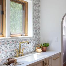 Kitchen Sink With Spanish-Style Tile Backsplash 