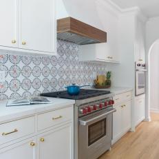 White Kitchen With Spanish-Style Tile Backsplash