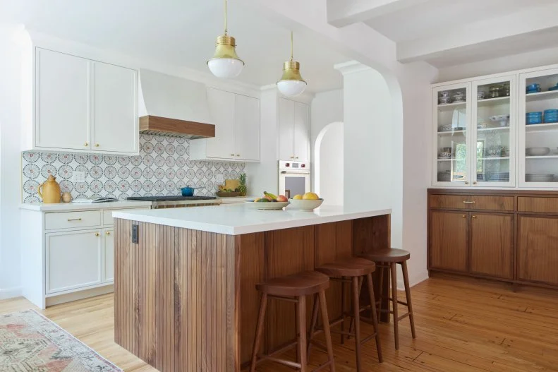 Kitchen With Beadboard Island and Two Gold Pendant Lights