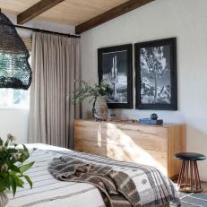 Neutral Transitional Bedroom With Cactus Art