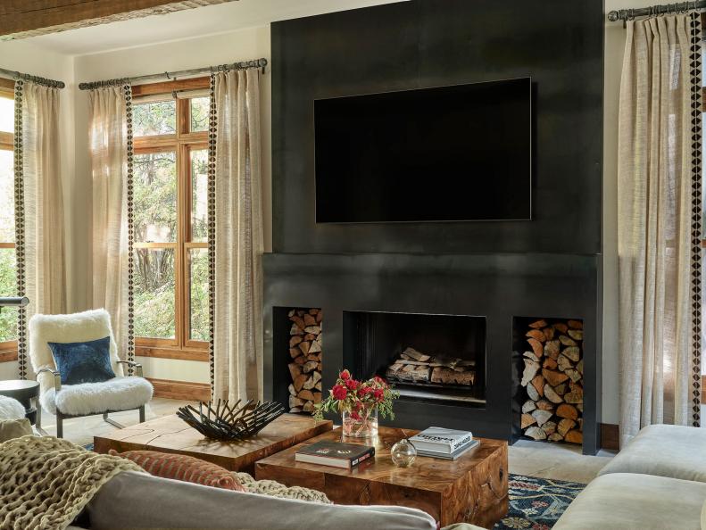 Living Room With Black Steel Fireplace