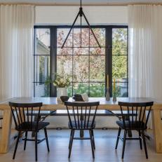 Neutral Contemporary Dining Room With Black Chairs