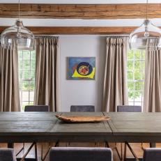 Brown Contemporary Dining Room With Wood Beams
