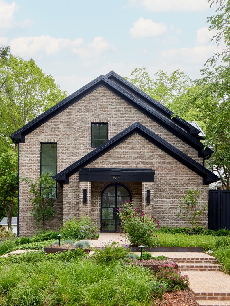 Sleek Brick Cottage With Black Trim