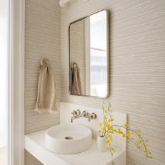 Neutral Transitional Powder Room With Yellow Flowers