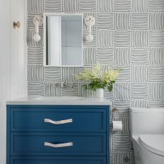 Blue and White Bathroom With Striped Tiles