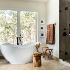 Soaking Tub and Natural Materials Give Primary Bathroom Zen Ambiance