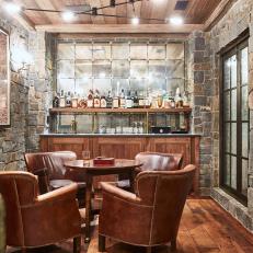 Stone Walls Give Neutral Cigar Bar Room Old World Appeal