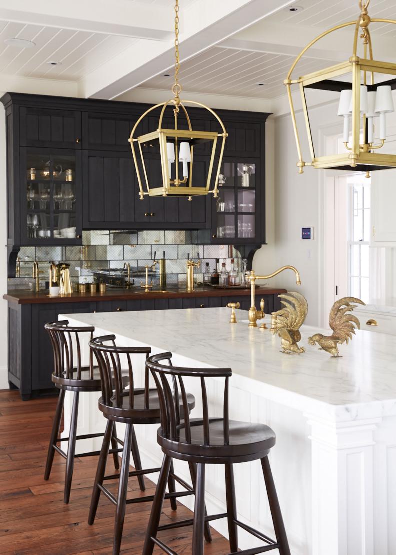 Barstools at Kitchen Island Topped With Gold-Colored Rooster Statues